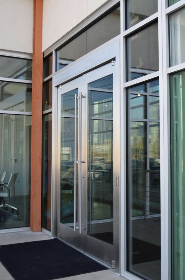 A photo of an architectural building product. An exterior entrance to a large building, showing glass doors.